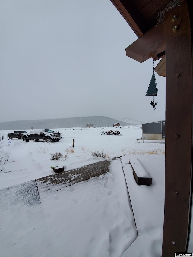 view of yard layered in snow