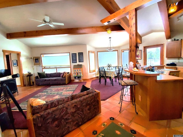 tiled living room featuring ceiling fan and lofted ceiling with beams