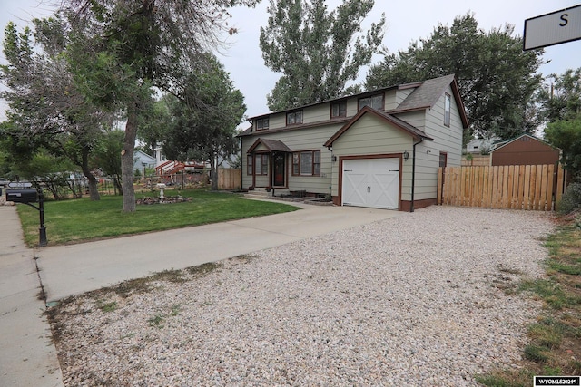 view of front of house featuring a garage and a front yard