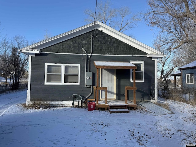 view of snow covered house