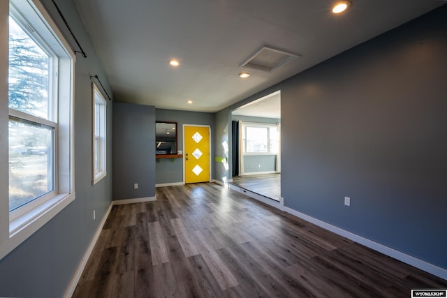 empty room with dark wood-type flooring