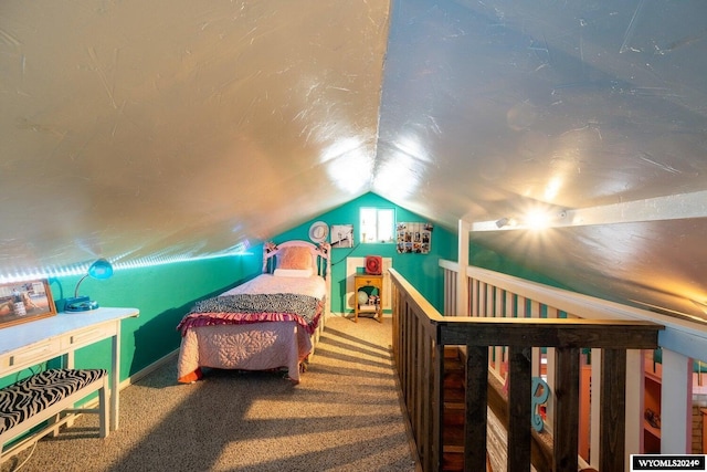 bedroom with carpet and vaulted ceiling