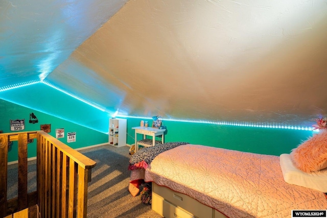 bedroom featuring carpet and lofted ceiling