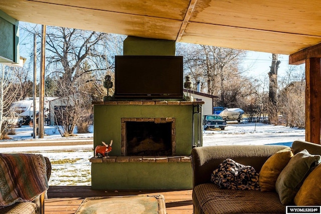 exterior space featuring an outdoor fireplace