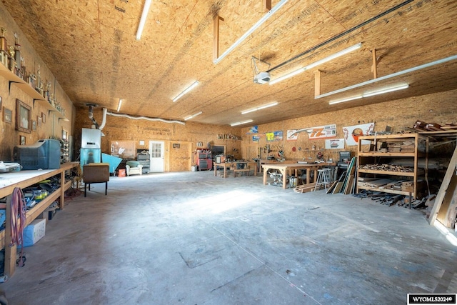 garage featuring a workshop area and a garage door opener