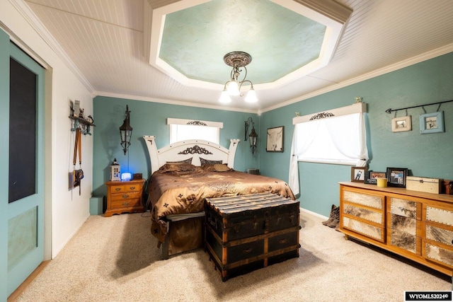 carpeted bedroom with a tray ceiling, an inviting chandelier, and crown molding