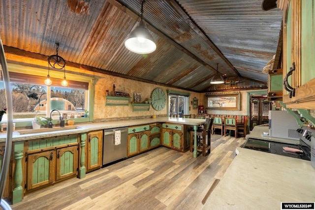 kitchen featuring stainless steel dishwasher, sink, lofted ceiling with beams, decorative light fixtures, and light hardwood / wood-style floors