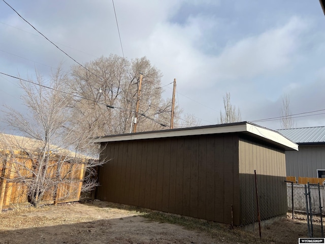 view of home's exterior featuring an outdoor structure