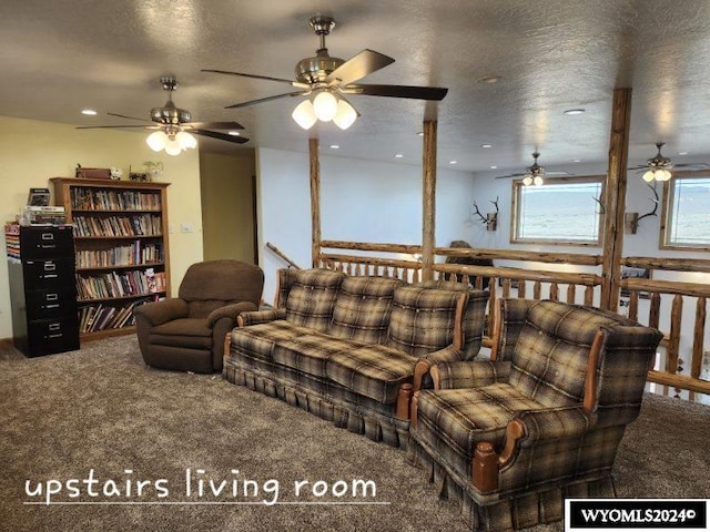 living room featuring a textured ceiling and carpet floors