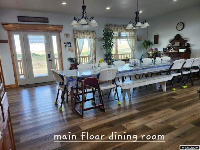 dining room with a chandelier and dark wood-type flooring