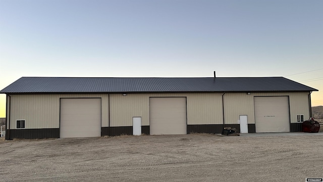 outdoor structure at dusk with a garage