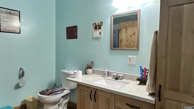 bathroom with vanity and toilet