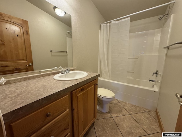 full bathroom featuring tile patterned floors, shower / bath combo, toilet, and vanity