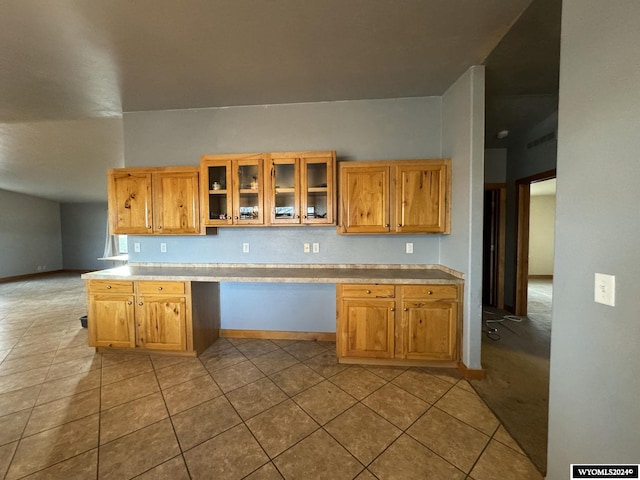 kitchen with light colored carpet