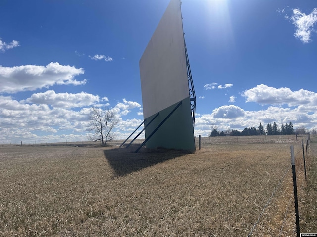 view of yard with a rural view