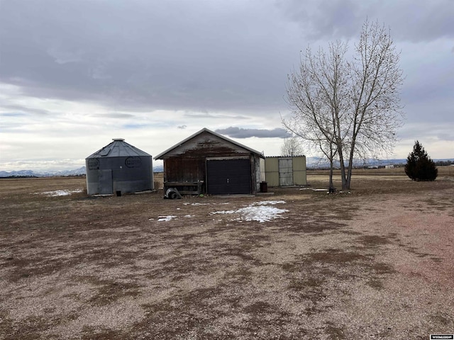 view of outdoor structure featuring a rural view