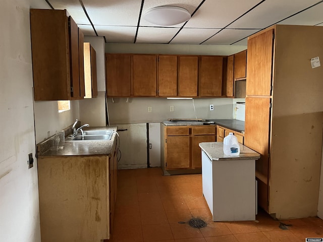 kitchen with sink and a drop ceiling