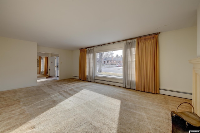 unfurnished living room with light colored carpet and a baseboard heating unit