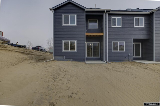 600 Badger Ln, Mills, WY 82644 - rear view of house featuring a balcony