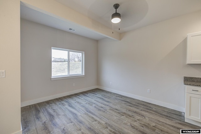 interior space with ceiling fan and light wood-type flooring