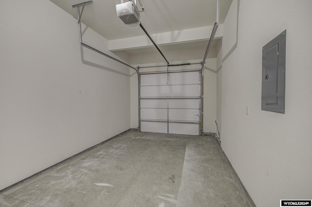 garage featuring electric panel and a garage door opener