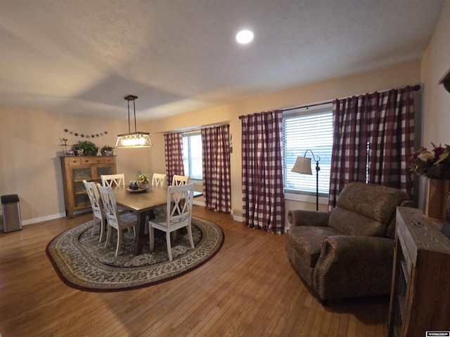 dining area with hardwood / wood-style floors