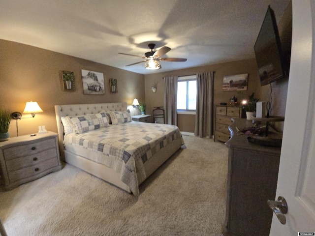 bedroom featuring ceiling fan and carpet flooring