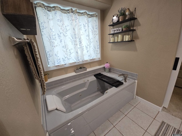 bathroom with tile patterned flooring and tiled tub