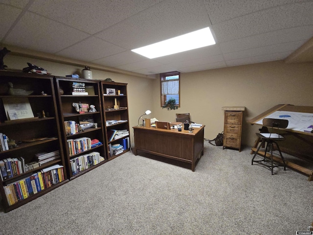 office area featuring light carpet and a paneled ceiling