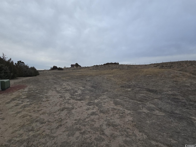 view of yard with a rural view