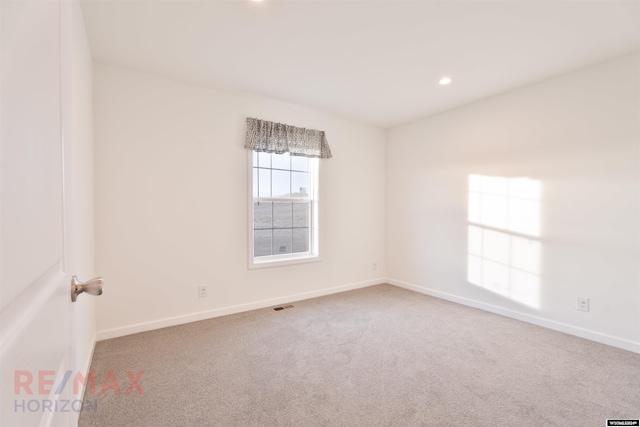 empty room featuring carpet flooring