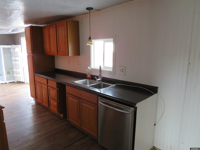 kitchen with dishwasher, hanging light fixtures, dark hardwood / wood-style floors, and sink