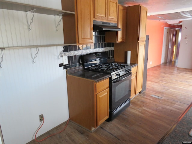 kitchen with wood-type flooring, backsplash, and black range with gas cooktop