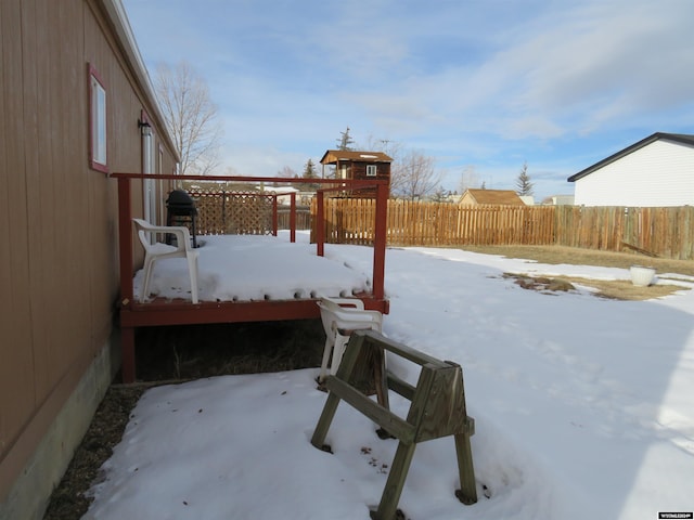 view of yard layered in snow