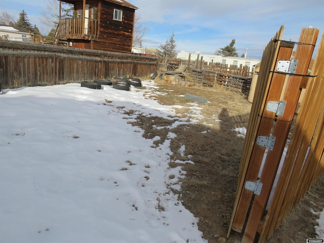 view of yard layered in snow