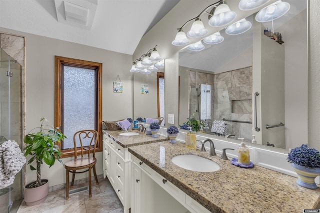 9 Spotted Tail Cir, Rock Springs, WY 82901 - bathroom with lofted ceiling, a tile shower, and double vanity