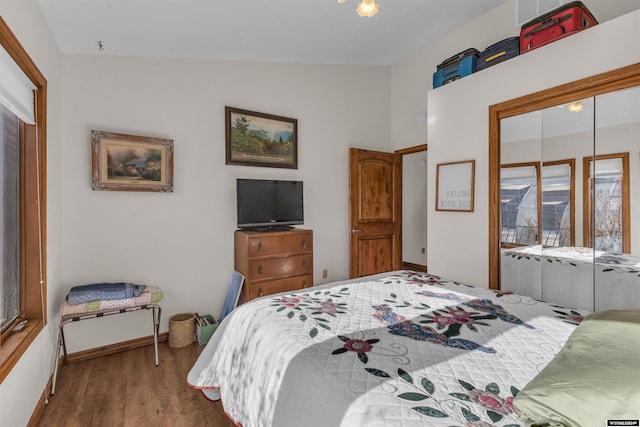 9 Spotted Tail Cir, Rock Springs, WY 82901 - bedroom with wood finished floors, lofted ceiling, and a closet