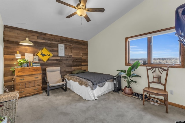 9 Spotted Tail Cir, Rock Springs, WY 82901 - bedroom with wood walls, vaulted ceiling, carpet flooring, and ceiling fan