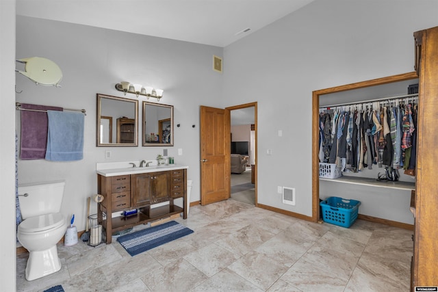 9 Spotted Tail Cir, Rock Springs, WY 82901 - full bathroom featuring vanity and high vaulted ceiling