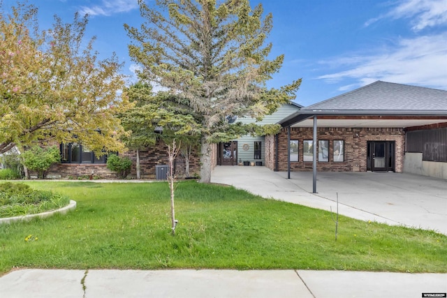9 Spotted Tail Cir, Rock Springs, WY 82901 - view of front facade featuring a front lawn and brick siding