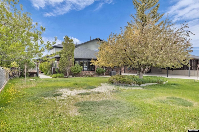 9 Spotted Tail Cir, Rock Springs, WY 82901 - rear view of property featuring a shingled roof