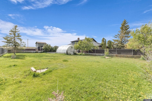 9 Spotted Tail Cir, Rock Springs, WY 82901 - view of yard featuring a greenhouse and an outbuilding