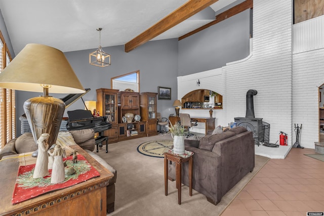 9 Spotted Tail Cir, Rock Springs, WY 82901 - living room featuring a wood stove, high vaulted ceiling, and beam ceiling