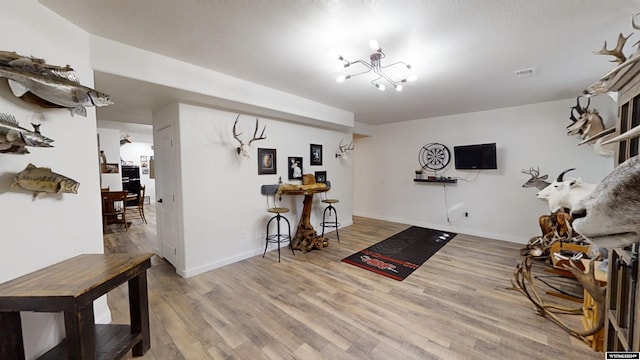 interior space with hardwood / wood-style floors and a notable chandelier