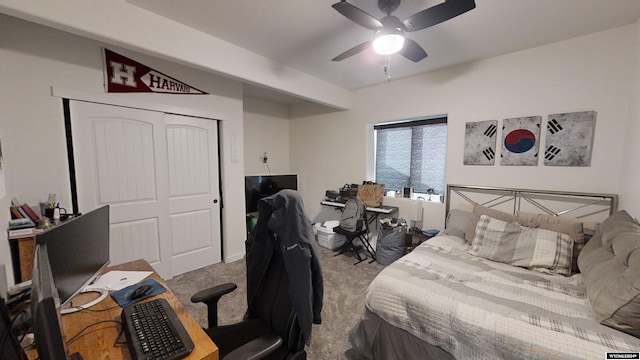 carpeted bedroom with ceiling fan and a closet