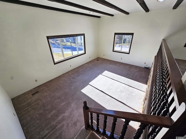 interior space featuring beam ceiling