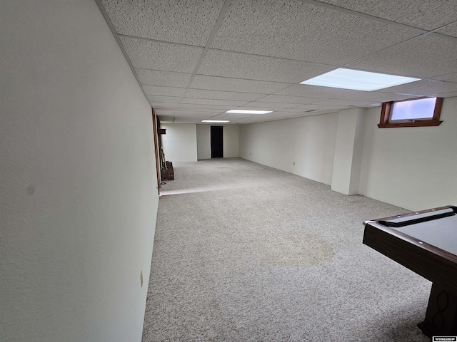 basement featuring carpet flooring, a drop ceiling, and billiards