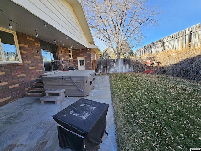 exterior space with a patio and a hot tub