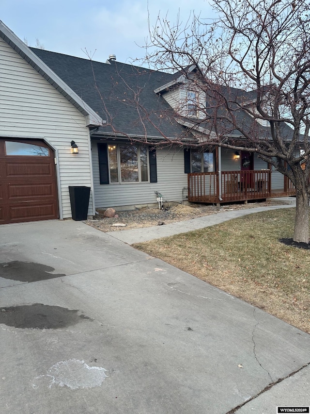 view of front of house with a garage and a front yard