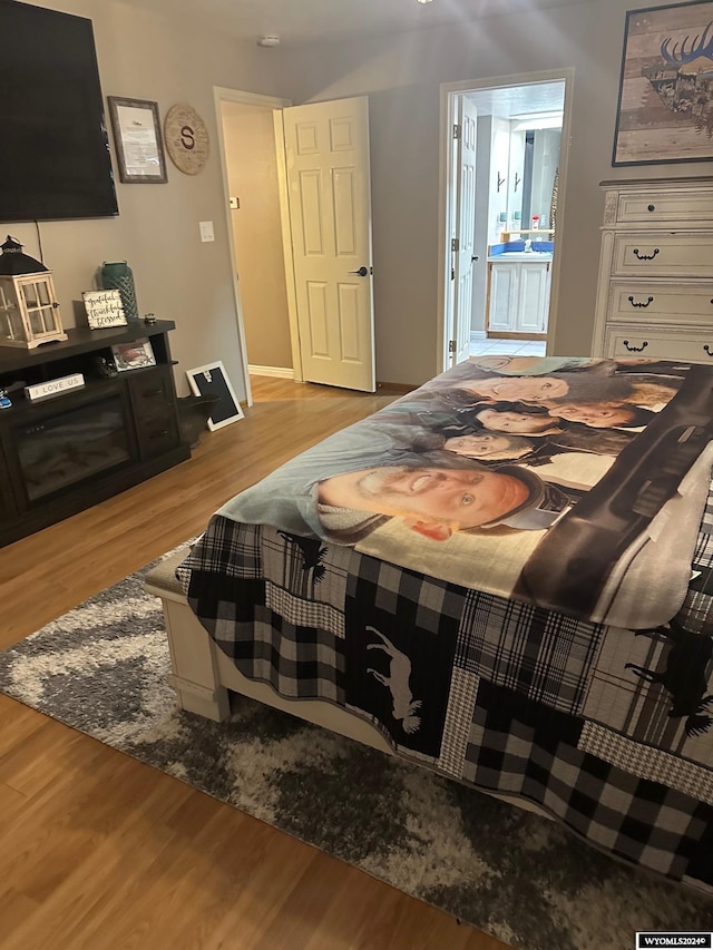 bedroom with light hardwood / wood-style flooring